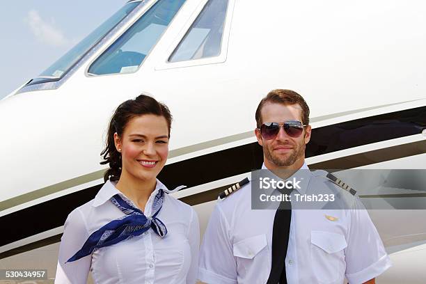 Pilot And Stewardess Ready For Passengers Stock Photo - Download Image Now - Adult, Adults Only, Air Stewardess