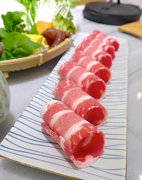istock Hot pot beef rolls closeup on a plate 530436996