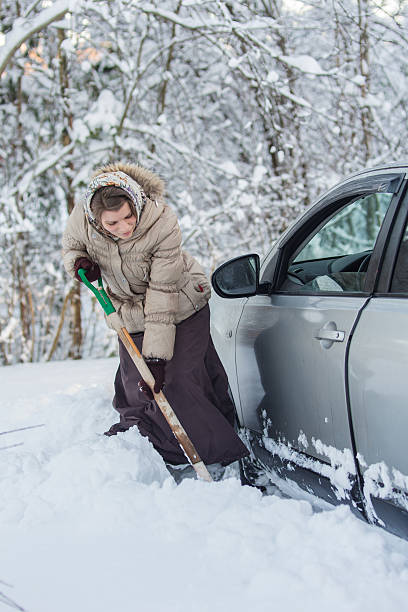 istock woman digs car out 530437918