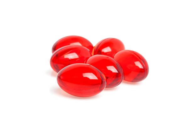 istock Pills of vitamin E isolated on white background 530438157