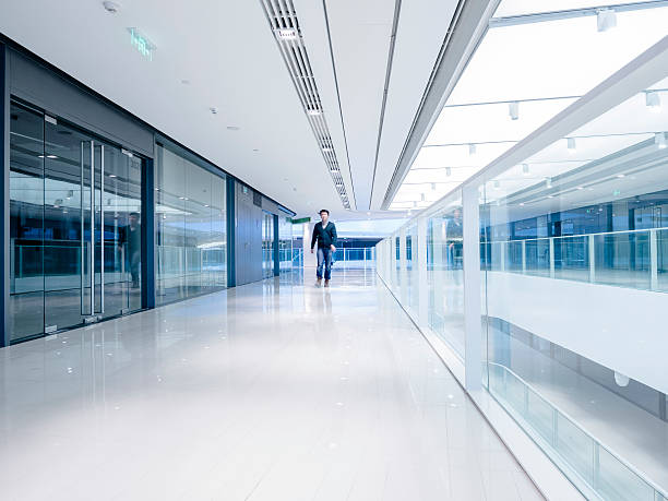 istock Young aisian businessman walking in architecture 530438387