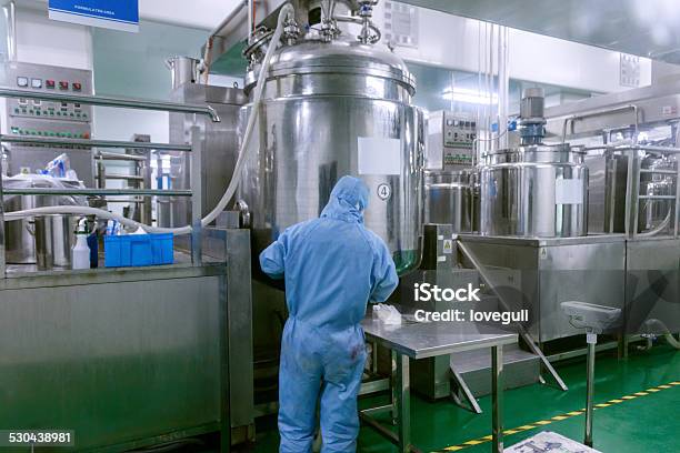 Technician Check Manufacture Equipment And Reactors In Pharmacy Factory Stock Photo - Download Image Now
