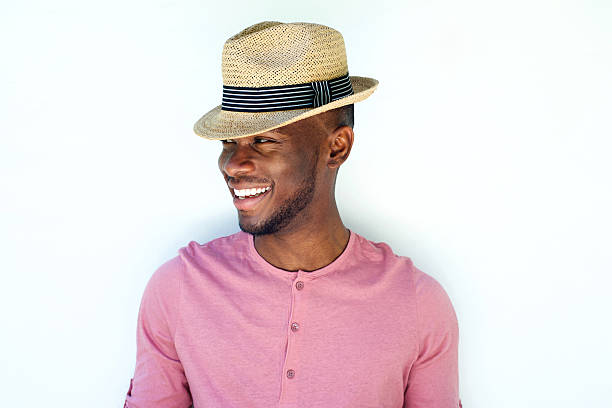 istock Close up smiling young black man with hat 530439914