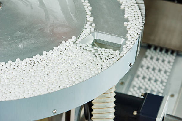 istock pharmacy medicine pill production background 530440012