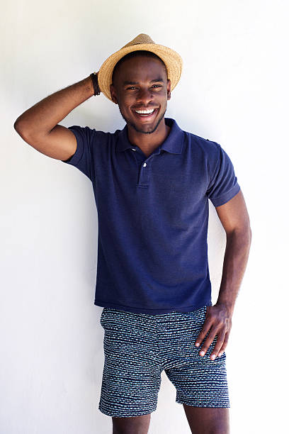 istock Happy young african man in shorts and hat 530440784