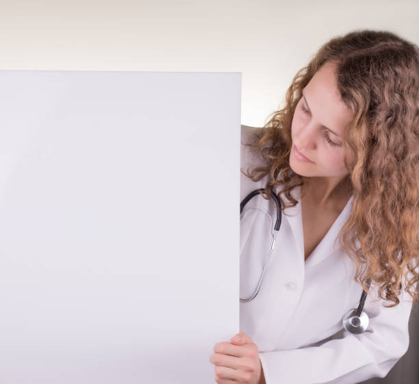 istock closeup of doctor's hands holding clipboard with 530440966
