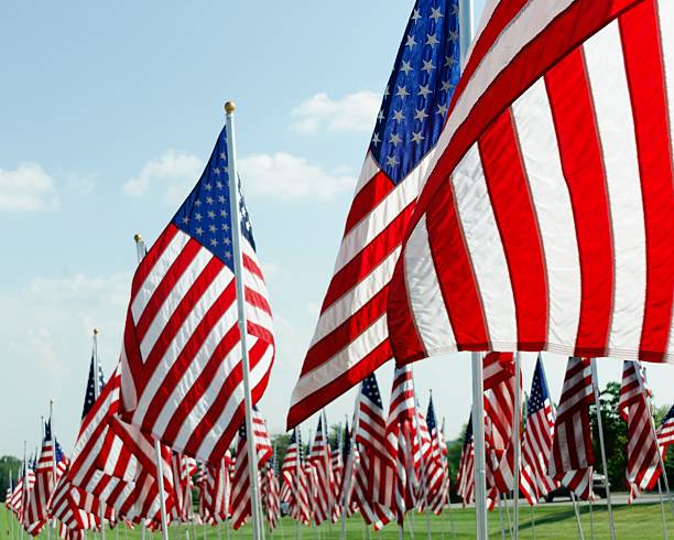 istock American Flags on Memorial Day at a Cemetery 530441088