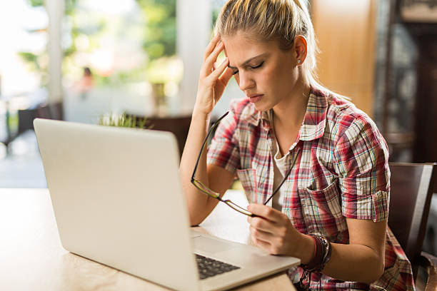 istock Young businesswoman using laptop and thinking of finding solution . 530441380