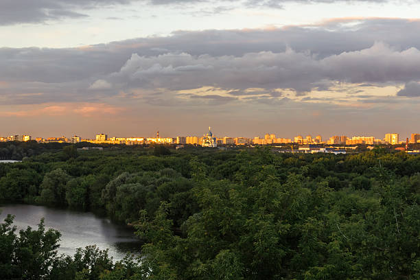 istock City under the storm clouds at sunset 530444449