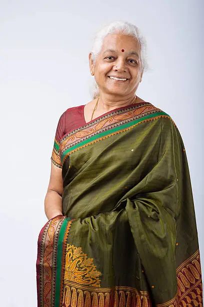 Portrait of smiling senior Indian woman in traditional costume