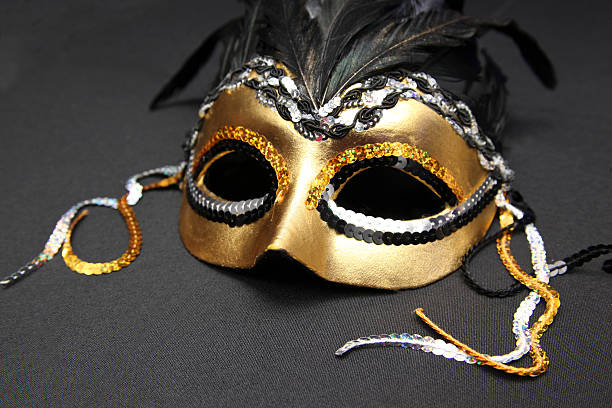 istock Gold and Black Mardi Gras Mask with Feathers 530445897
