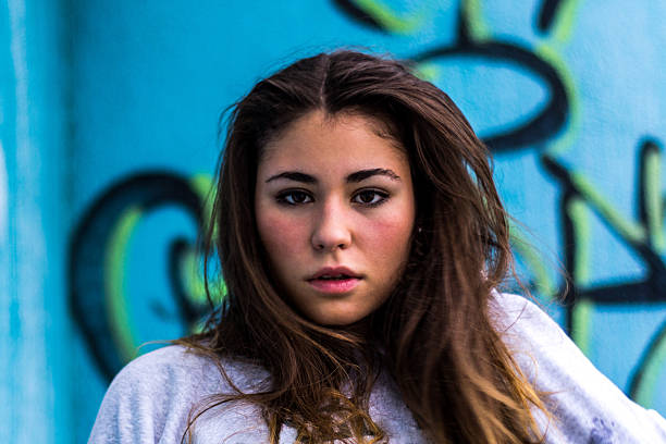 istock young girl look camera front blue 530456397