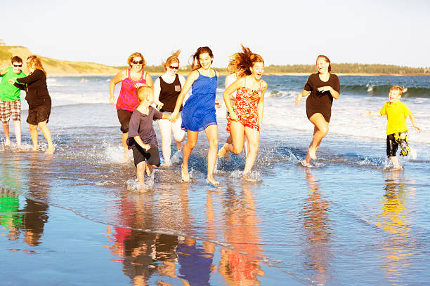 istock Families Running on the Beach 530457575