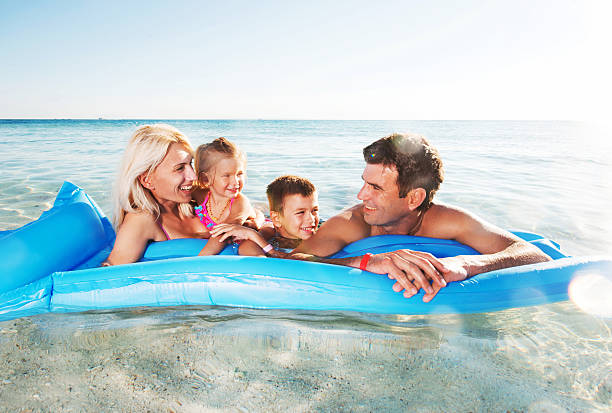istock Smiling family on pool raft. 530457877