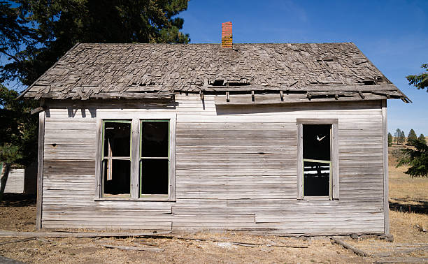 istock Run Down Abandoned Farm House Bleached Rotting Wood 530458135