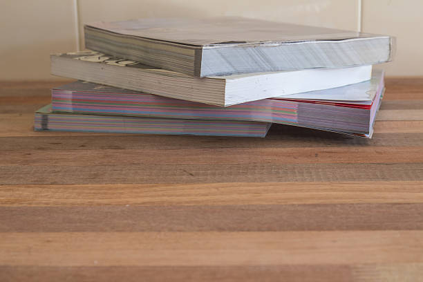 istock Books on wooden table and wall tiles. 530459093