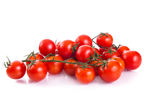 Red cherry tomatoes isolated on the white background.
