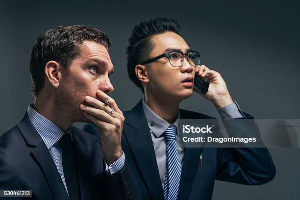 Anxious Financial Brokers Stock Photo - Download Image Now - Adult, Asian and Indian Ethnicities, Bad News