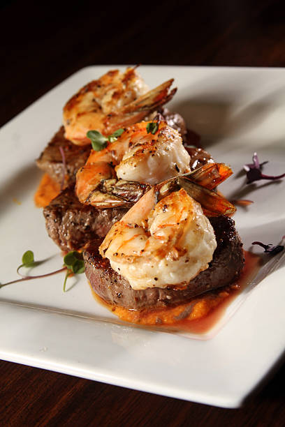 istock Gourmet surf and turf with white plate - angled 530467535