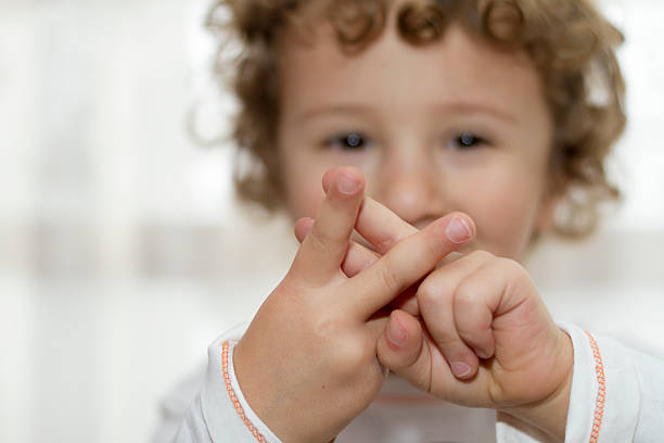 Little boy showing Hashtag sign stock photo