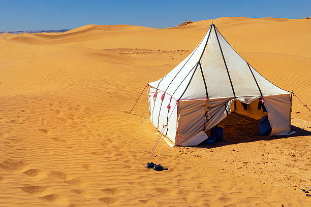 White Tuareg tent in the desert Erg Cheb Morocco Africa White Tuareg tent in the desert Erg Cheb Morocco North Africa Nikon D3x bedouin stock pictures, royalty-free photos & images