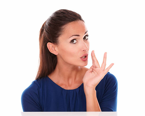 istock Cute young latin whispering a secret 530468891