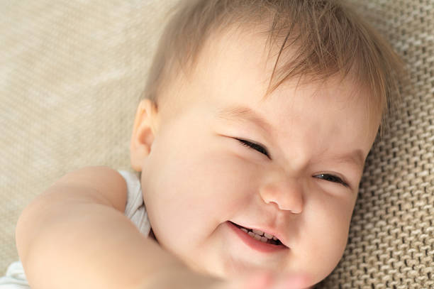 istock baby girl smiling 530472973