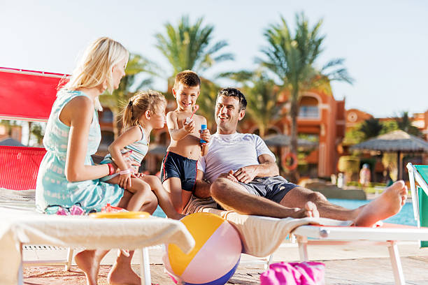 istock Family enjoying in summer day at poolside. 530477639
