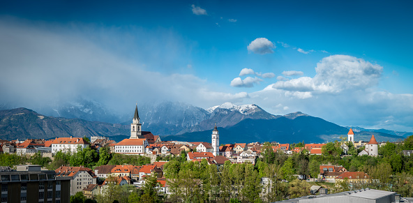 Kranj in Slovenia with St. Cantianus Church in the foreground and the Kamnik Alps behind
