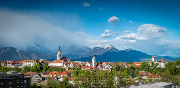 Kranj, Slovenia - Panorama view Kranj in Slovenia with St. Cantianus Church in the foreground and the Kamnik Alps behind krvavec stock pictures, royalty-free photos & images