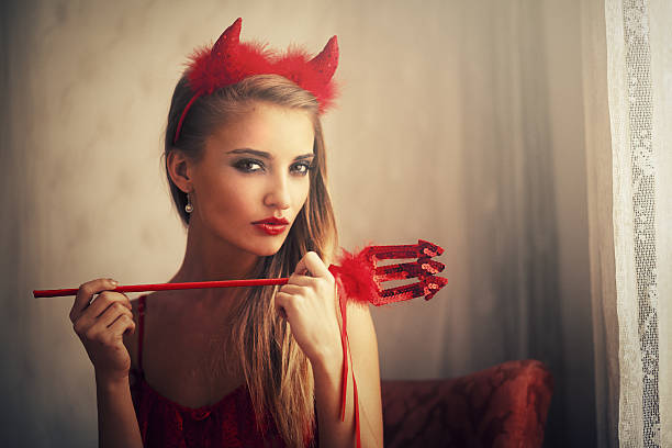 girl wearing devil dress girl wearing devil dress devil costume stock pictures, royalty-free photos & images