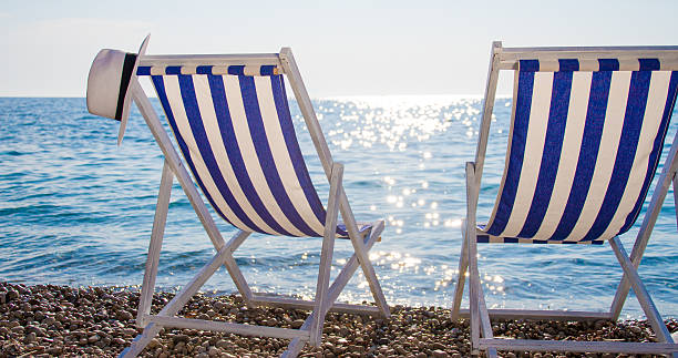 istock Striped deck chairs on shore at Vis island 530483654