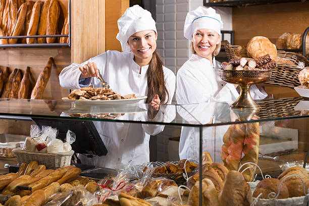 istock Smiling women at bakery 530484964