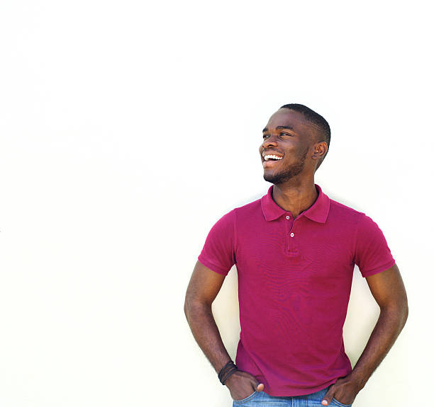 Young african male model smiling against white background