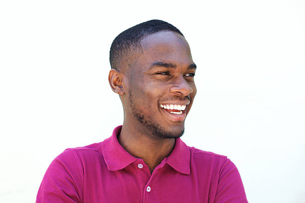 istock Laughing young african guy looking away 530486354