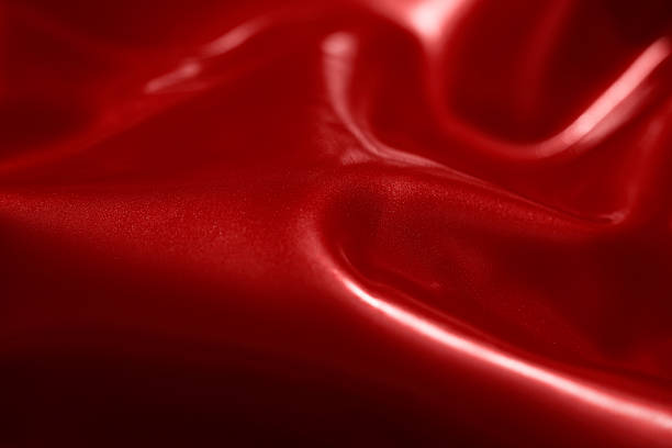 istock shiny red latex background 530486360
