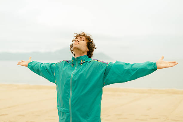 istock Breathing after training in summer on beach in sunset 530488016