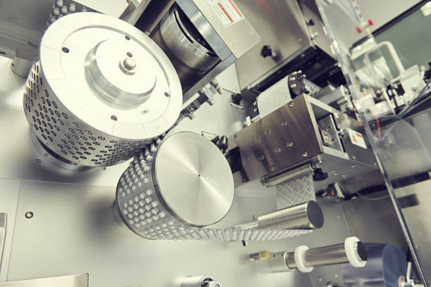 istock pharmaceutical tablet pill production. blistering packing machine 530488252