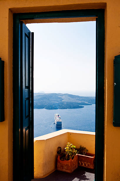 istock Santorini Ferry through a door gate at Fira 530489049