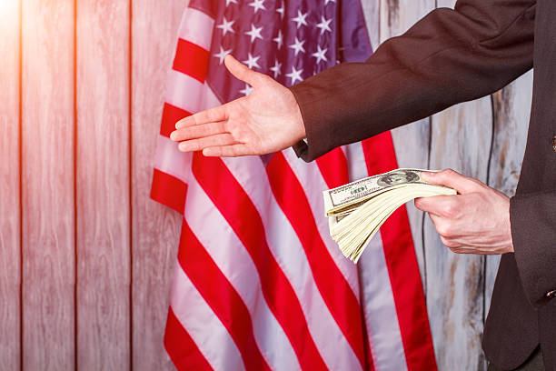 istock Businessman with dollars giving hand. 530491858