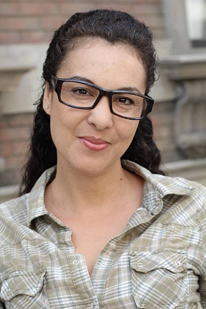 istock Real looking woman with glasses smiles 530492316