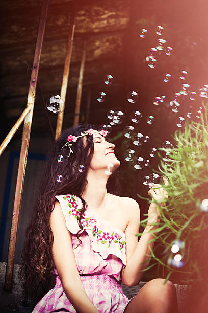 istock smiling woman and bubbles 530493556