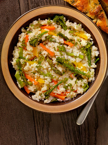 istock Vegetable Risotto with Fresh Parsley and Focaccia Bread 530493566