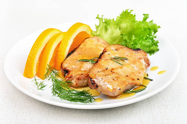 istock Pork chop with orange sauce 530494343