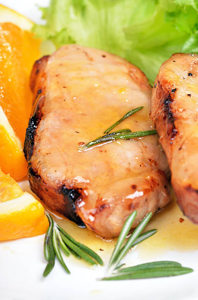 istock Pork chop with orange sauce 530494351