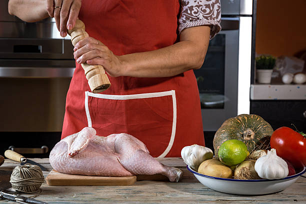 istock Unrecognizable woman cooking chicken 530494808