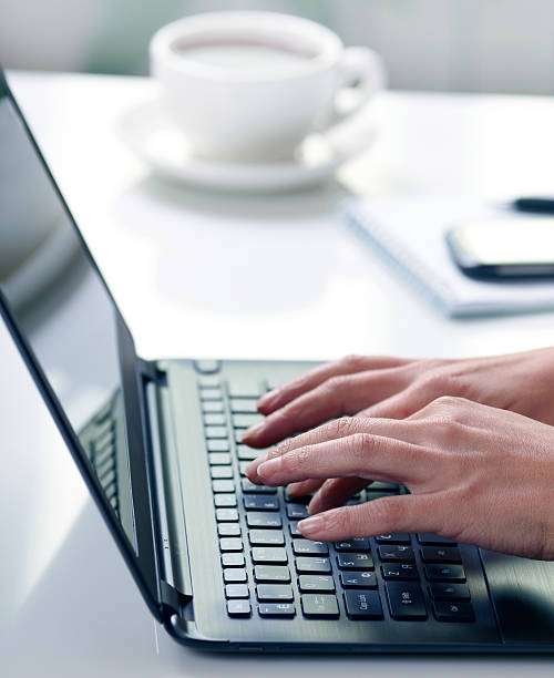 istock Woman hands typing on laptop 530494945