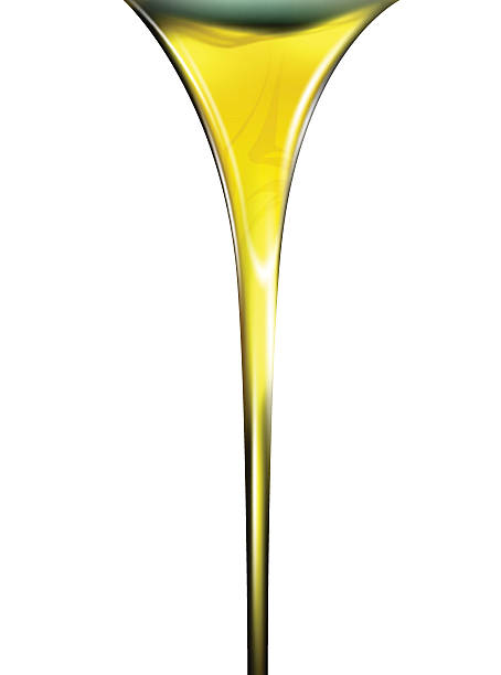 istock Pouring oil or golden liquid on white background. 530495744