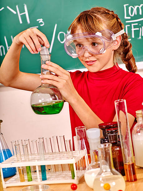 istock Child in chemistry class. 530496022