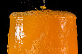 Orange soda large glass close up